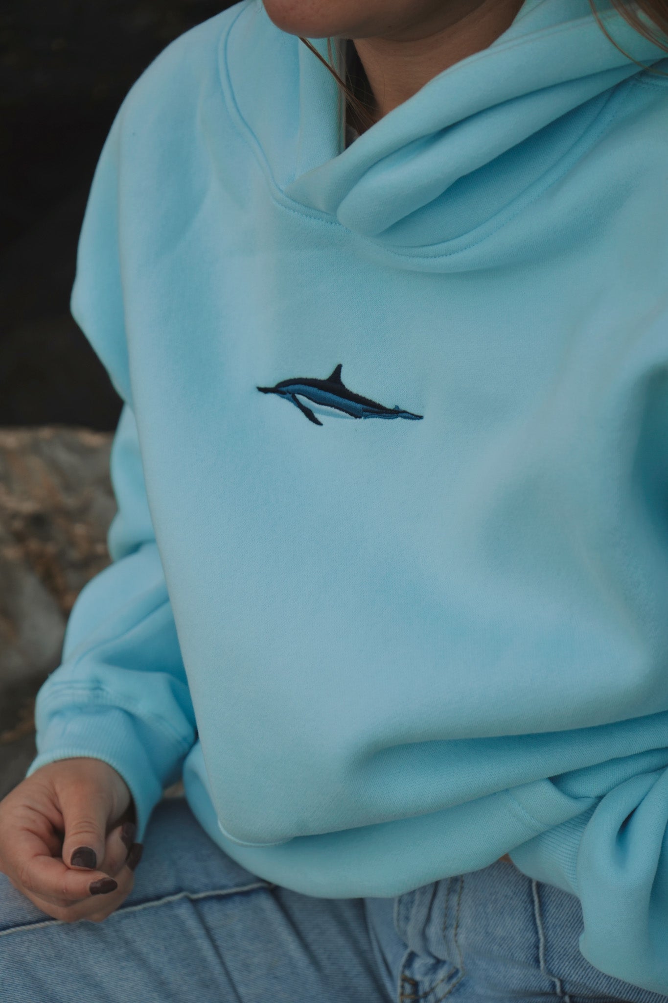Person wearing Cetacean Light Blue hoodie outdoors by Divermon Art
