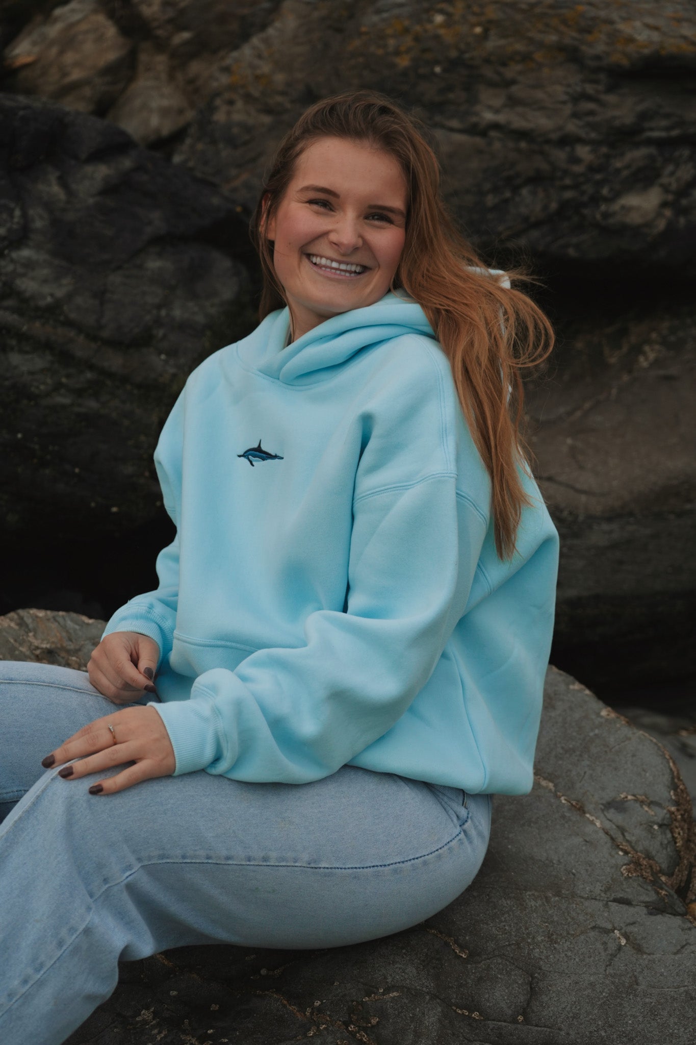 Person wearing Cetacean Light Blue hoodie outdoors by Divermon Art