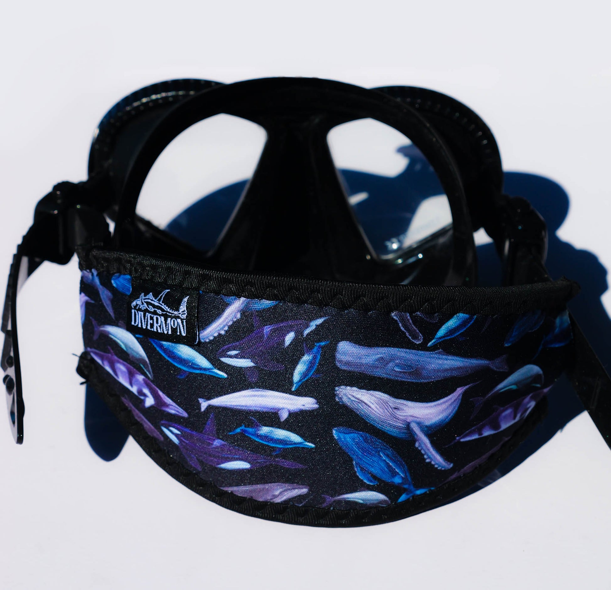 Cetacean black neoprene mask tamer with whale and dolphin shown in detail close up design by Diver Mon Art shown with mask 