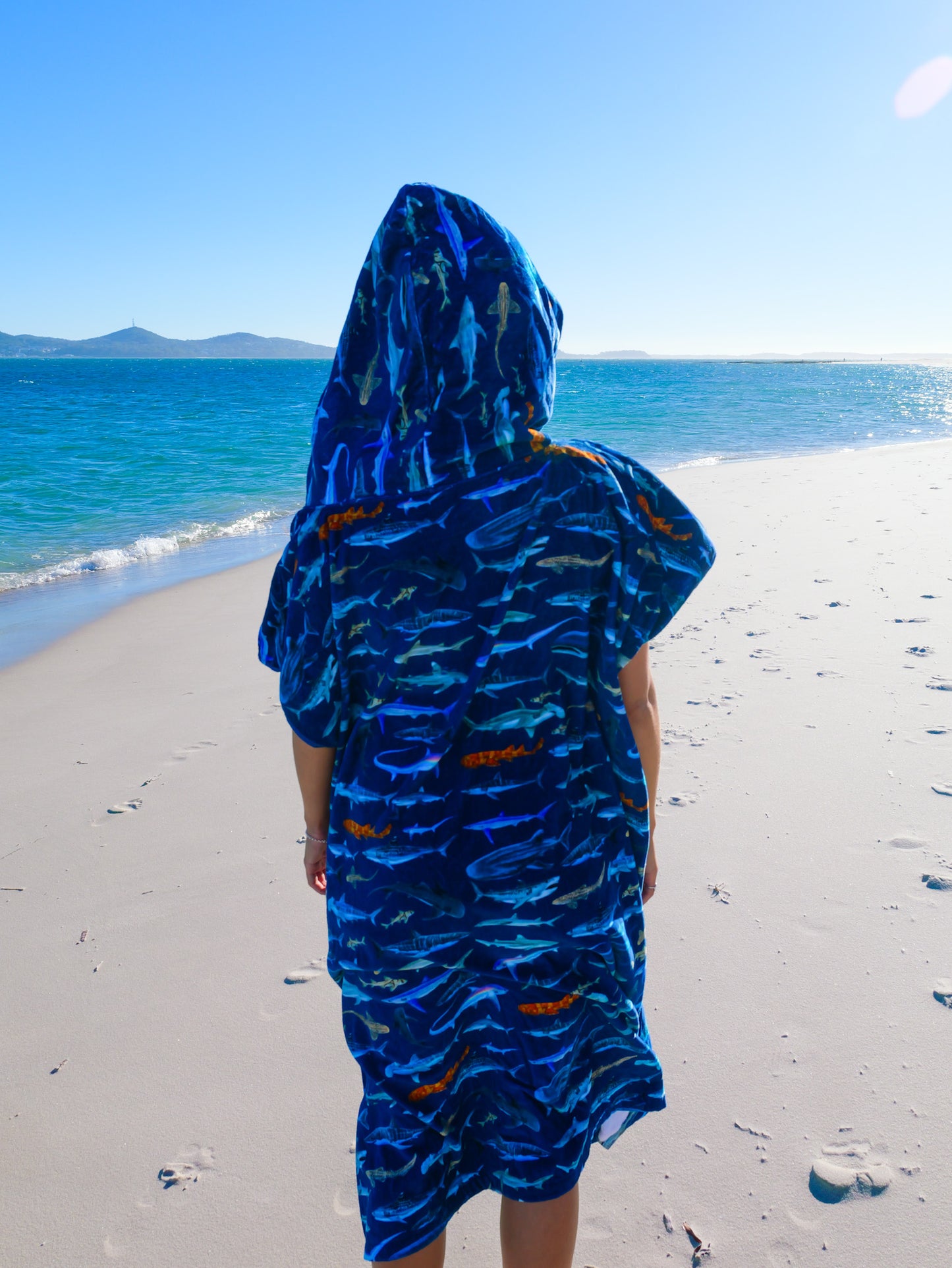 Person at the beach with Hooded Cotton Sharks XL towel Divermon Art