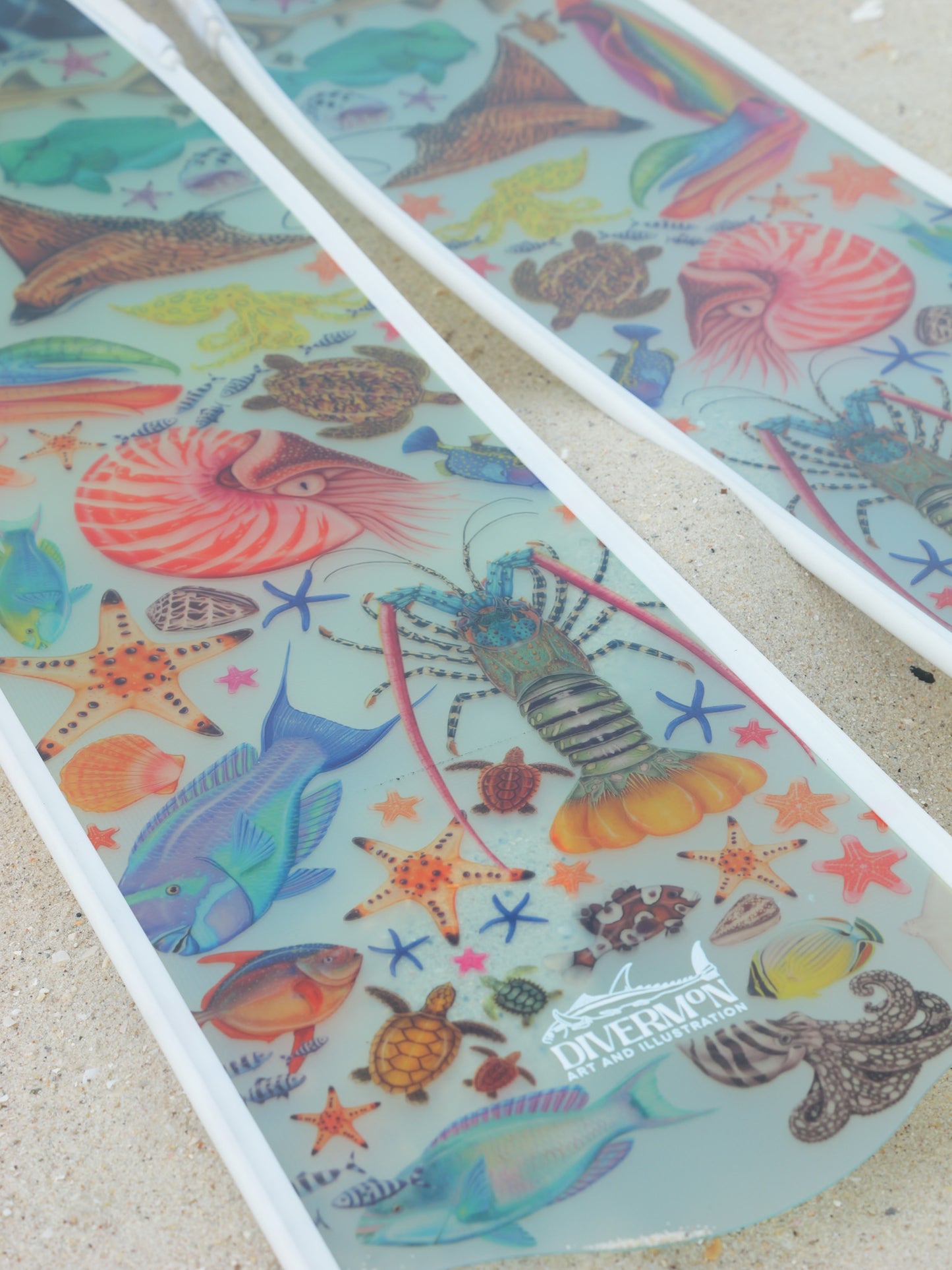 Long blade freediving fins featuring ocean marine life artwork by DiverMon for diving and spearfishing