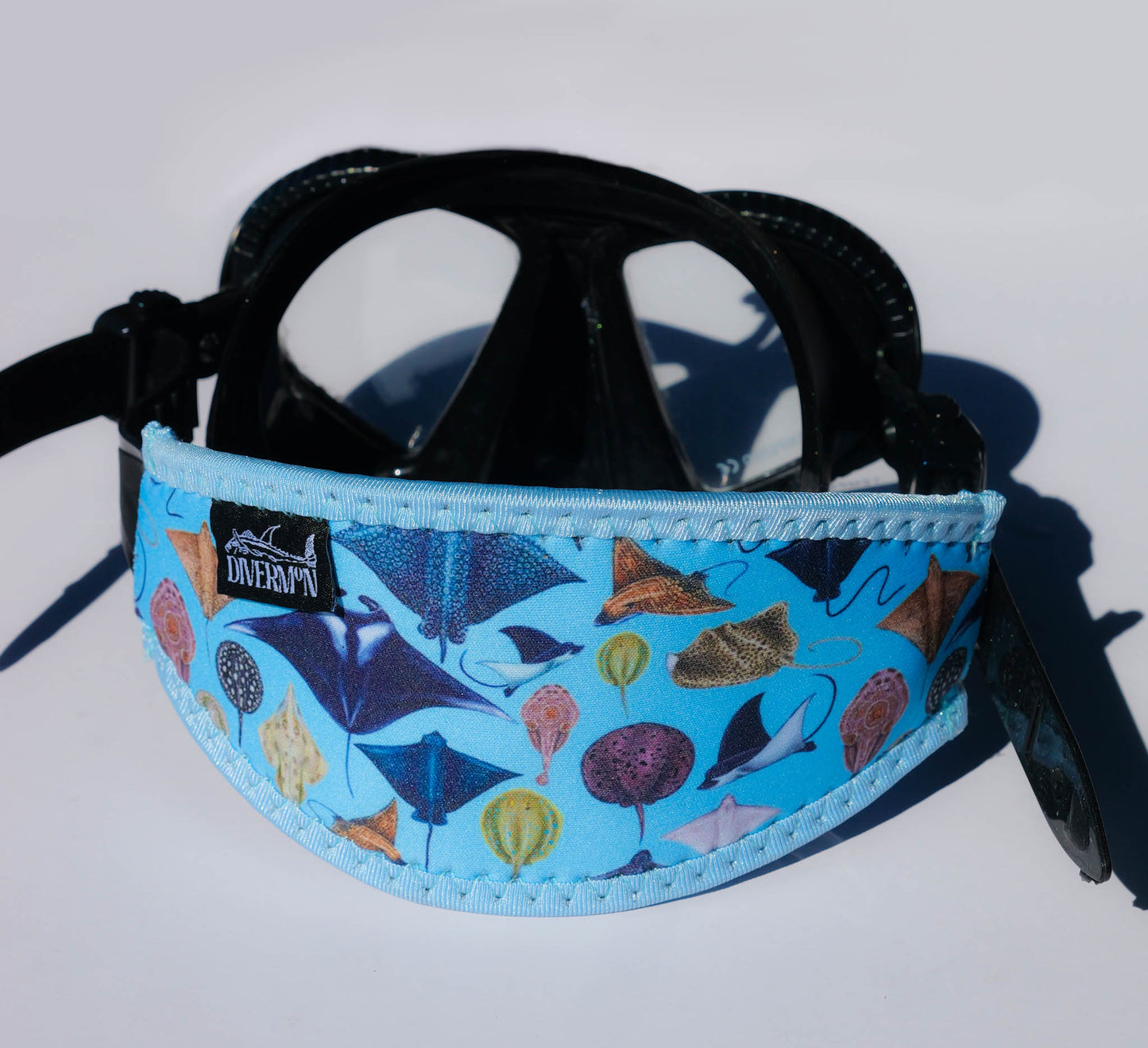Sting Ray and Manta ray design with a light blue background neoprene mask strap tamer ocean illustration by Diver Mon Art dive hair accessories
