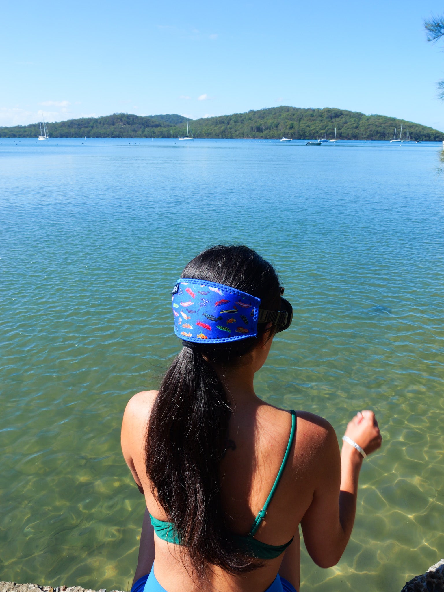 Dark haired woman side view in clear blue water Nudibranch Blue neoprene mask tamer design ocean illustration by Diver Mon Art 