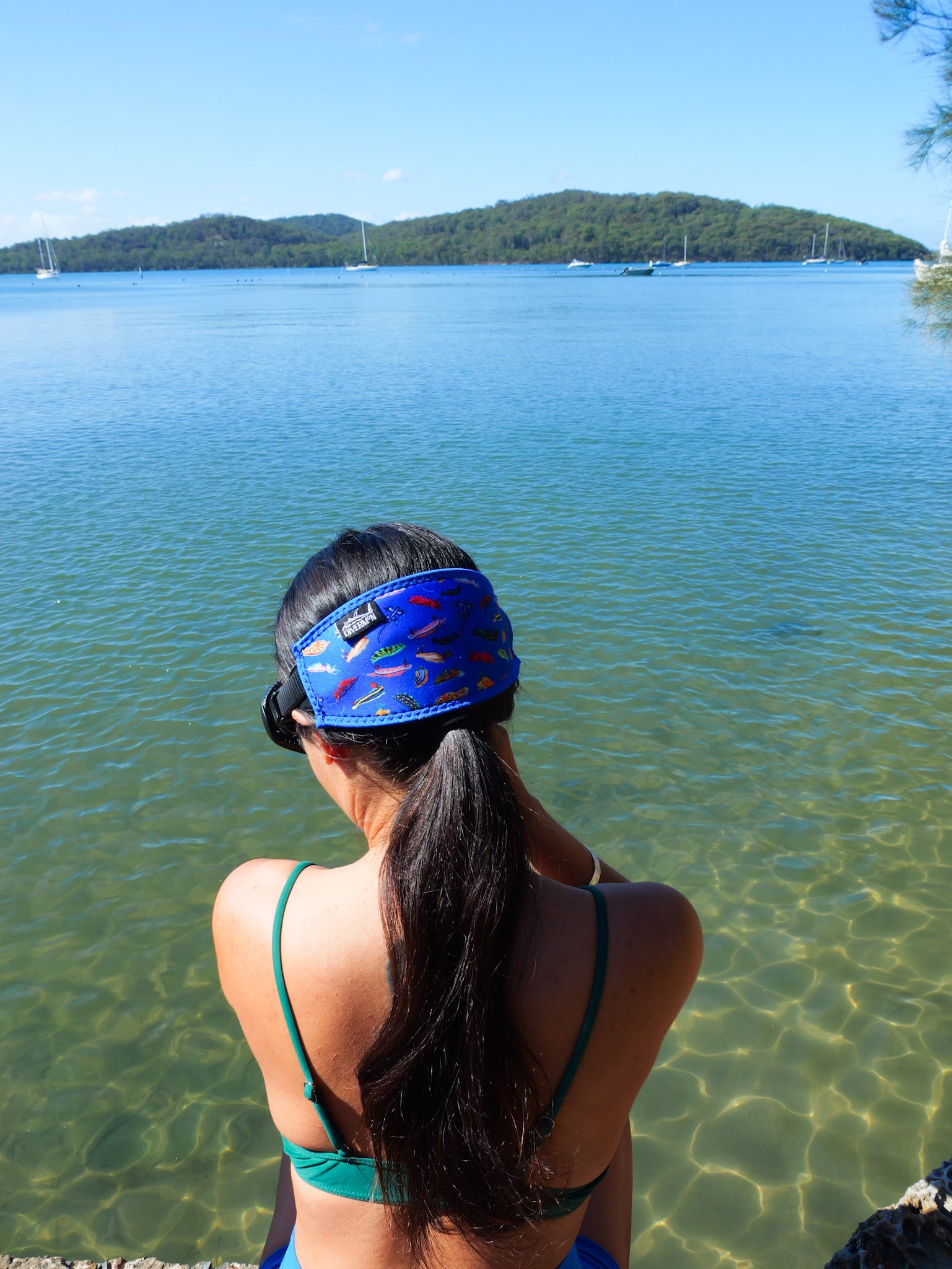 Dark haired woman side view in clear blue water Nudibranch Blue neoprene mask tamer design ocean illustration by Diver Mon Art 