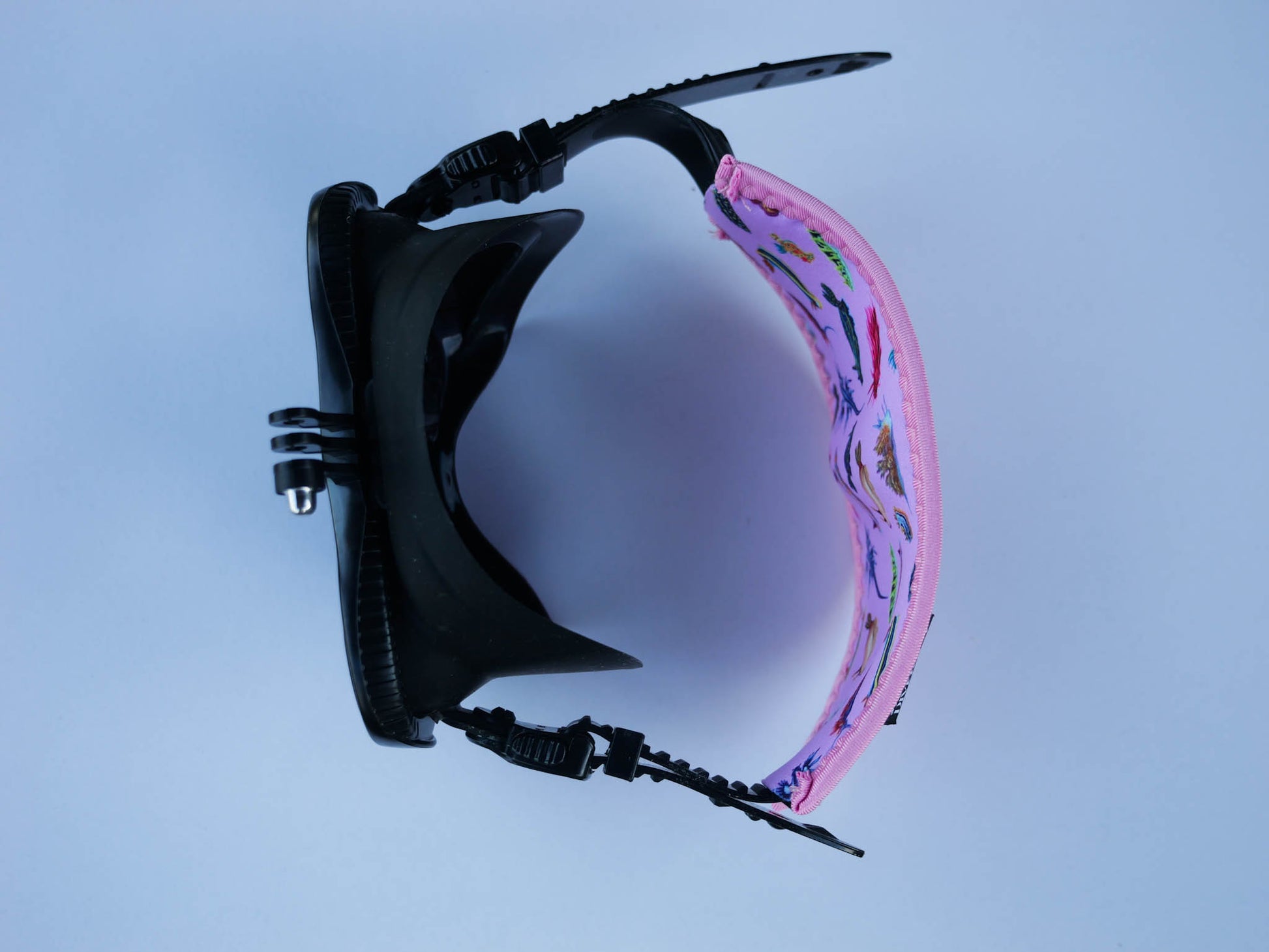 Top view of nudibranch pink neoprene mask tamer by Diver Mon Art shown with fitted to mask 
