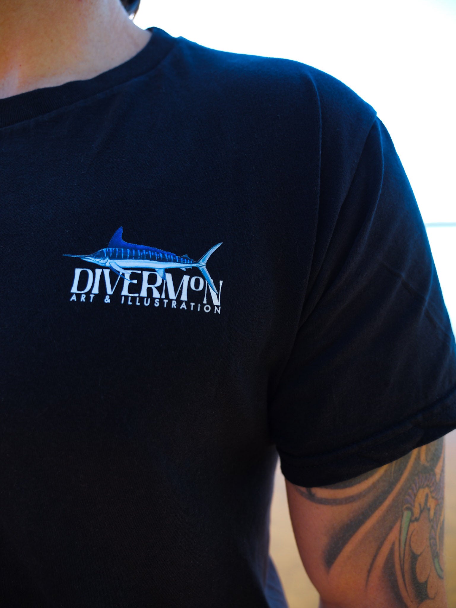 Black t-shirt with 'Diver Mon Art & Illustration' logo on a person wearing it.