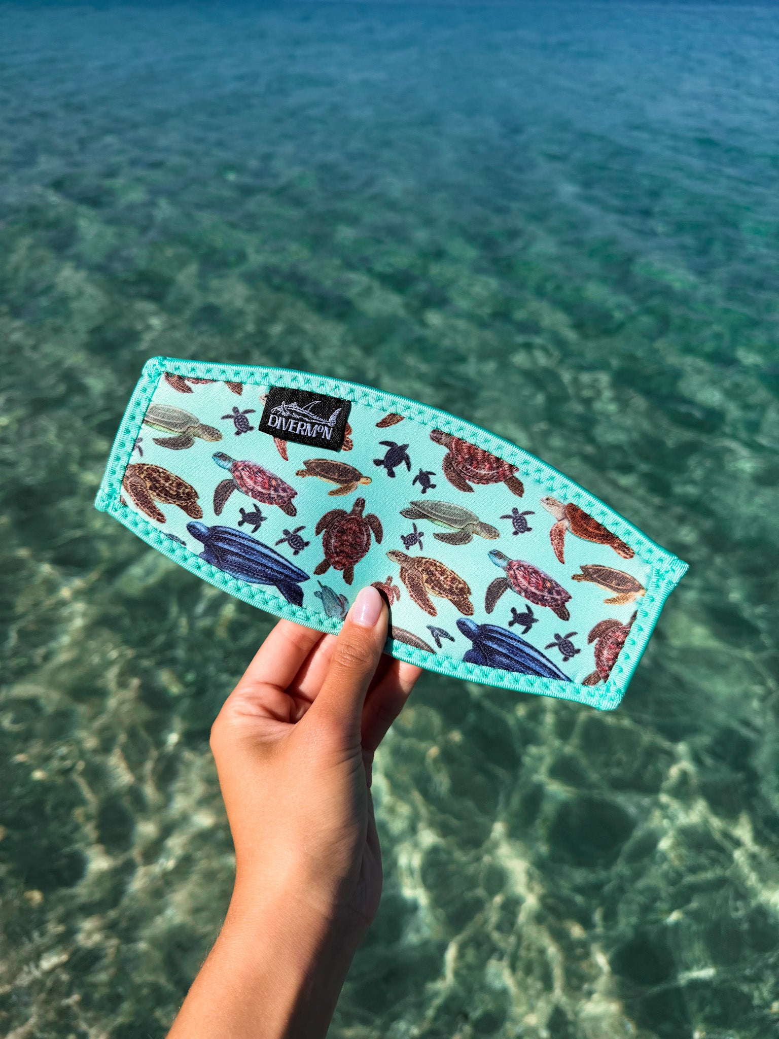 Sea turtle design with a light green background neoprene mask strap tamer ocean illustration by Diver Mon Art dive hair accessories
