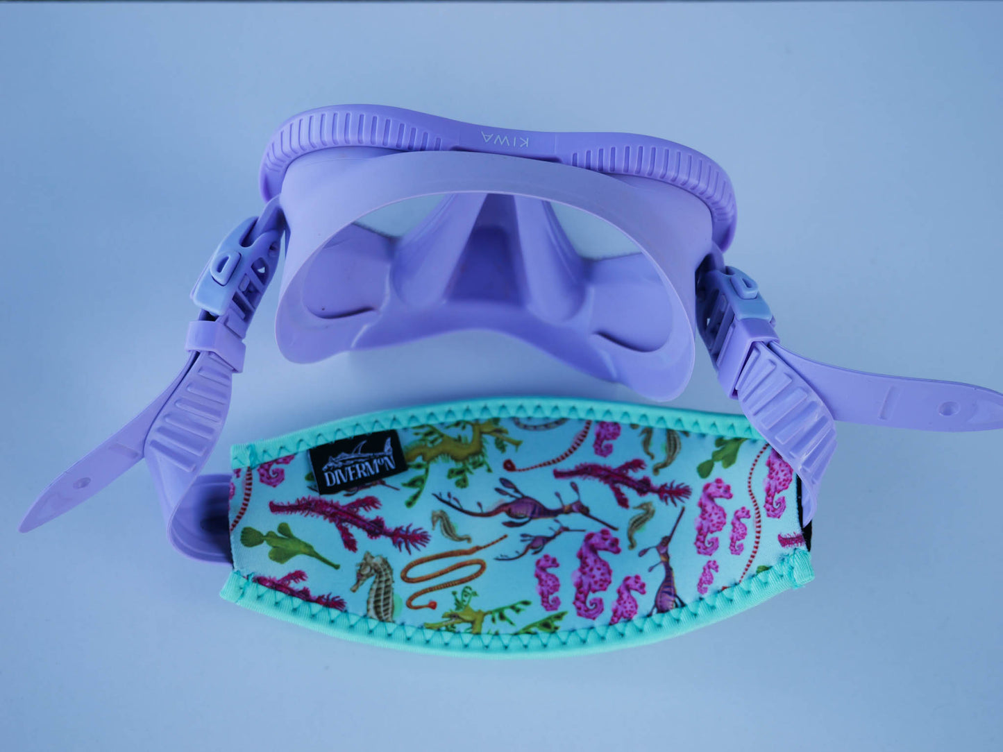 Seahorse green neoprene mask tamer close up in great detail by Diver Mon Art shown with fitted to purple mask