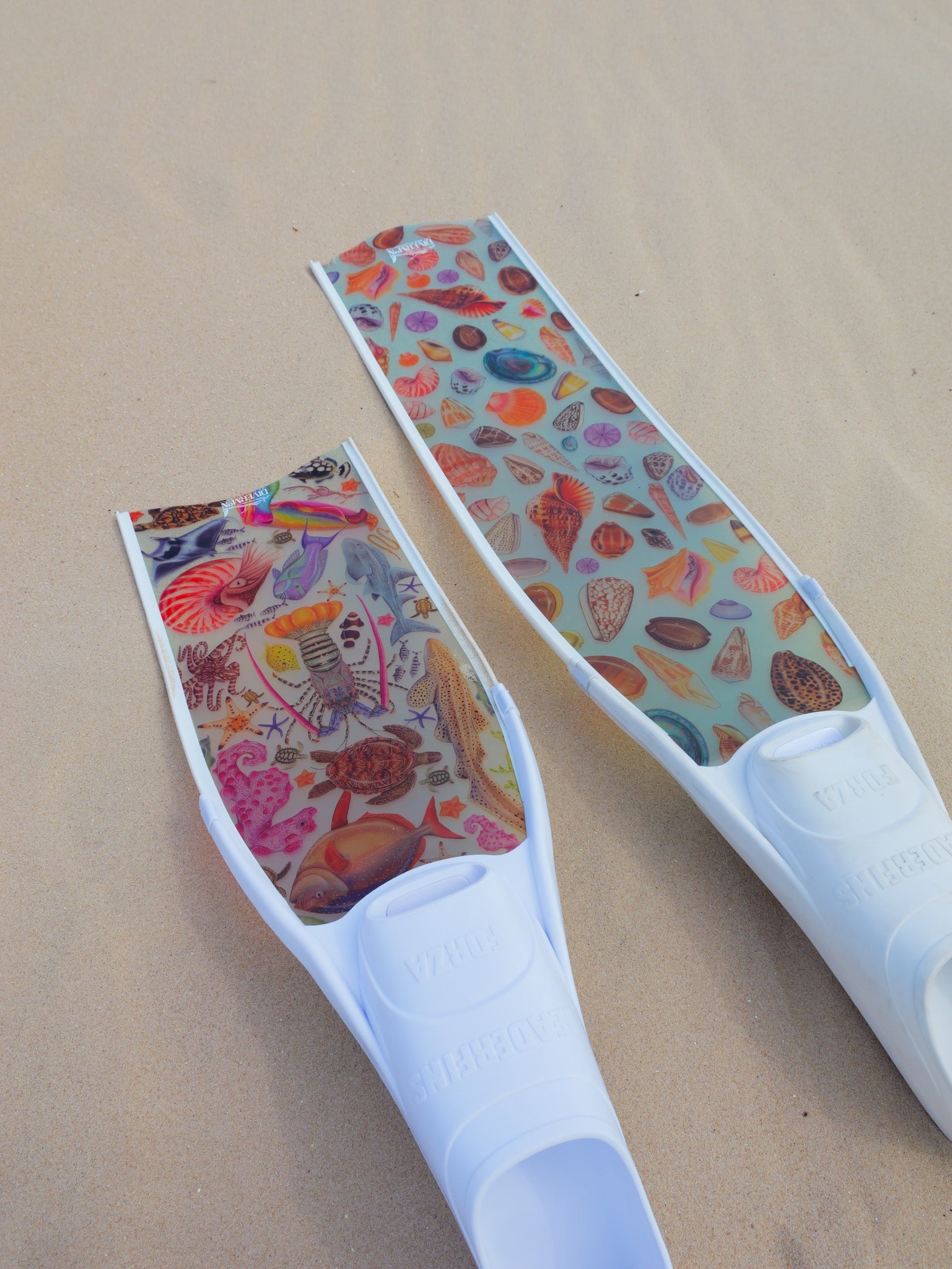 Short freediving fins for travel featuring rainbow ocean design with colourful marine life artwork by DiverMon