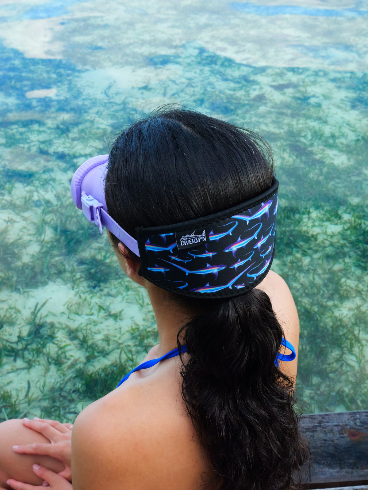 Dark haired woman shown from behind in blue clear water close up thresher black design neoprene mask strap tamer ocean illustration by Diver Mon Art