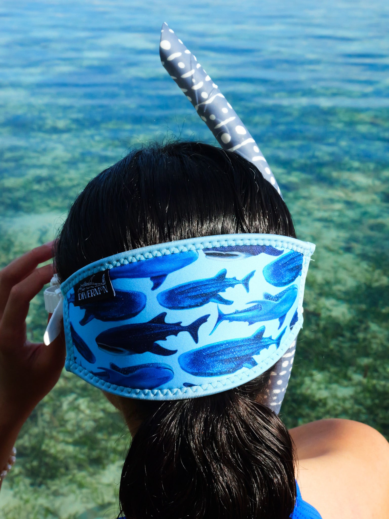 Dark haired woman shown from behind in blue clear water close up in great detail whale shark blue design neoprene mask strap tamer ocean illustration by Diver Mon Art